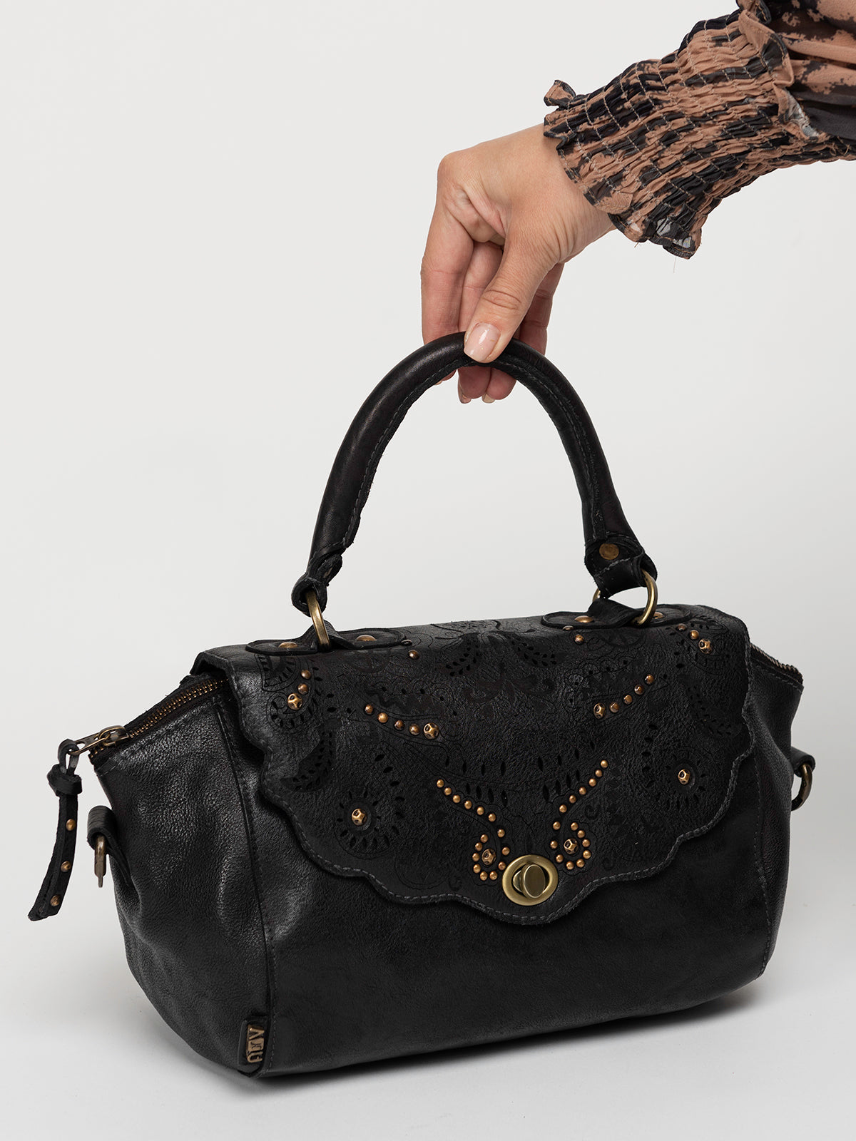 CAROB: Black leather laser cut work handbag by Art N Vintage
